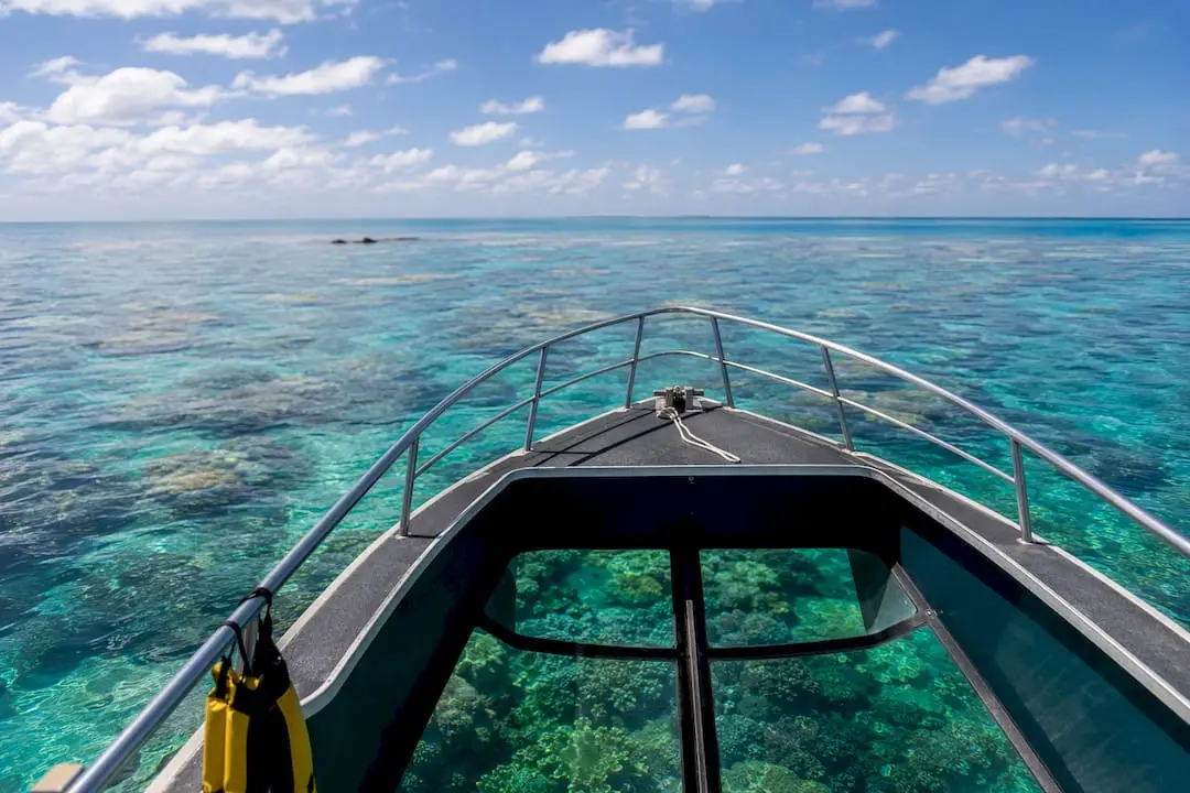 Glass-bottom boat over Great Barrier Reef coral