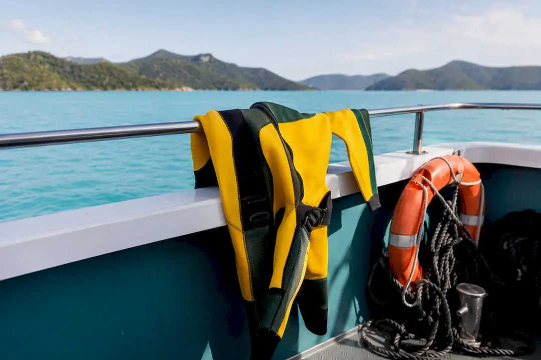 Stinger suit and safety gear on tour boat railing